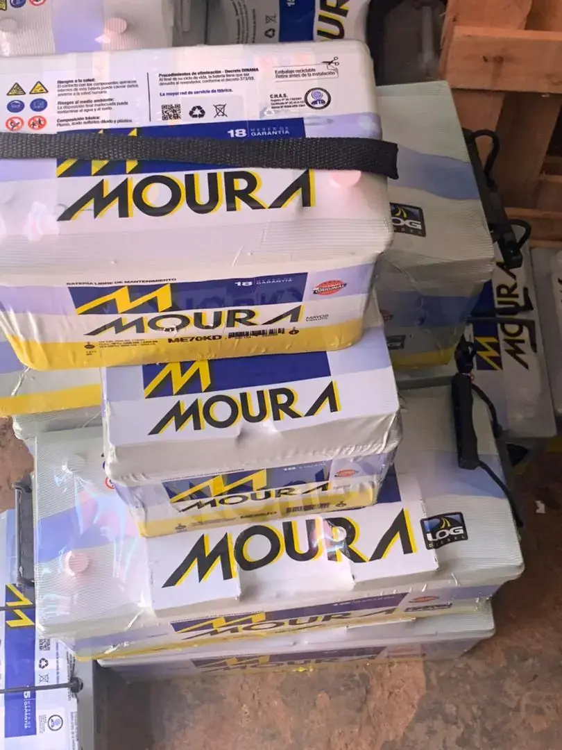 Moura vehicle batteries stacked in their boxes